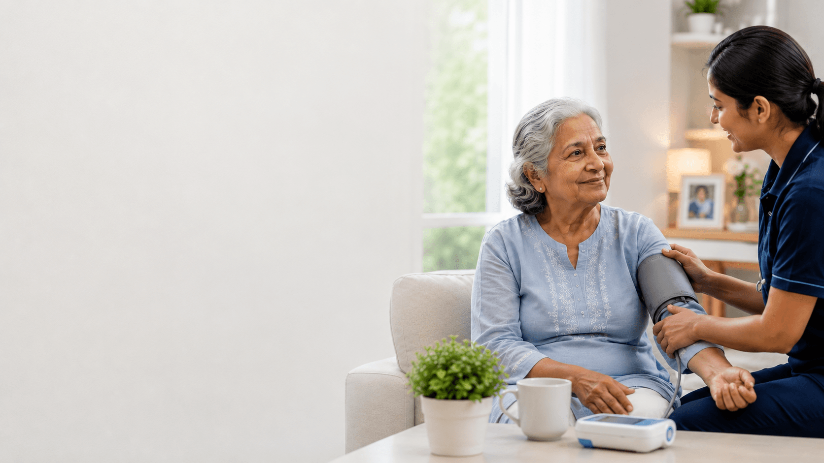 A caregiver checking blood pressure for an elderly woman at home